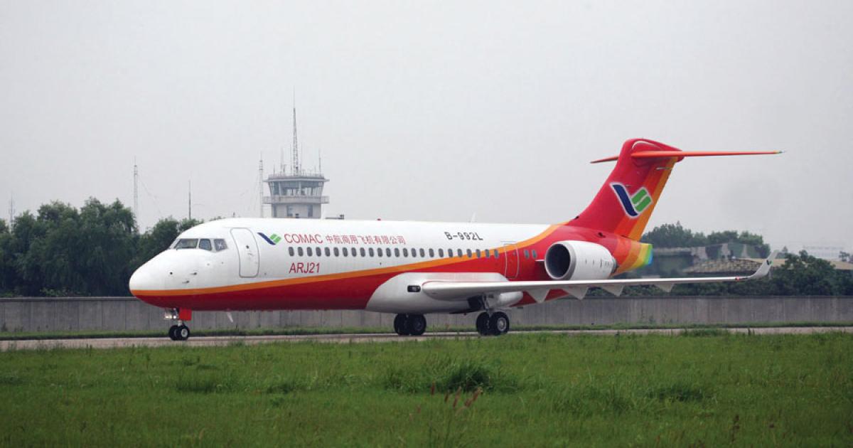 One of four ARJ21-700 protoypes taxies following a flight test in Shanghai. Beset by setbacks resulting from unspecified design changes and testing delays, the Chinese jet appears unlikely to earn certification before the middle of this year. 