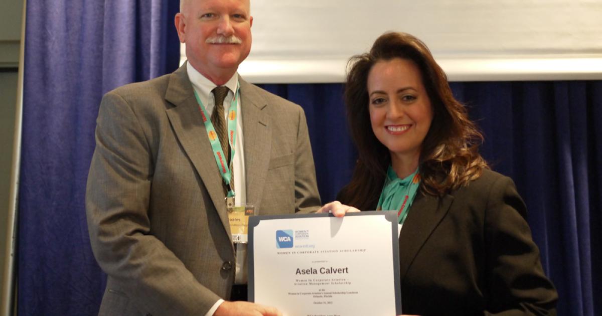 Asela Calvert was awarded the WCA Aviation Management Scholarship by Home Depot chief pilot Joe Coates.