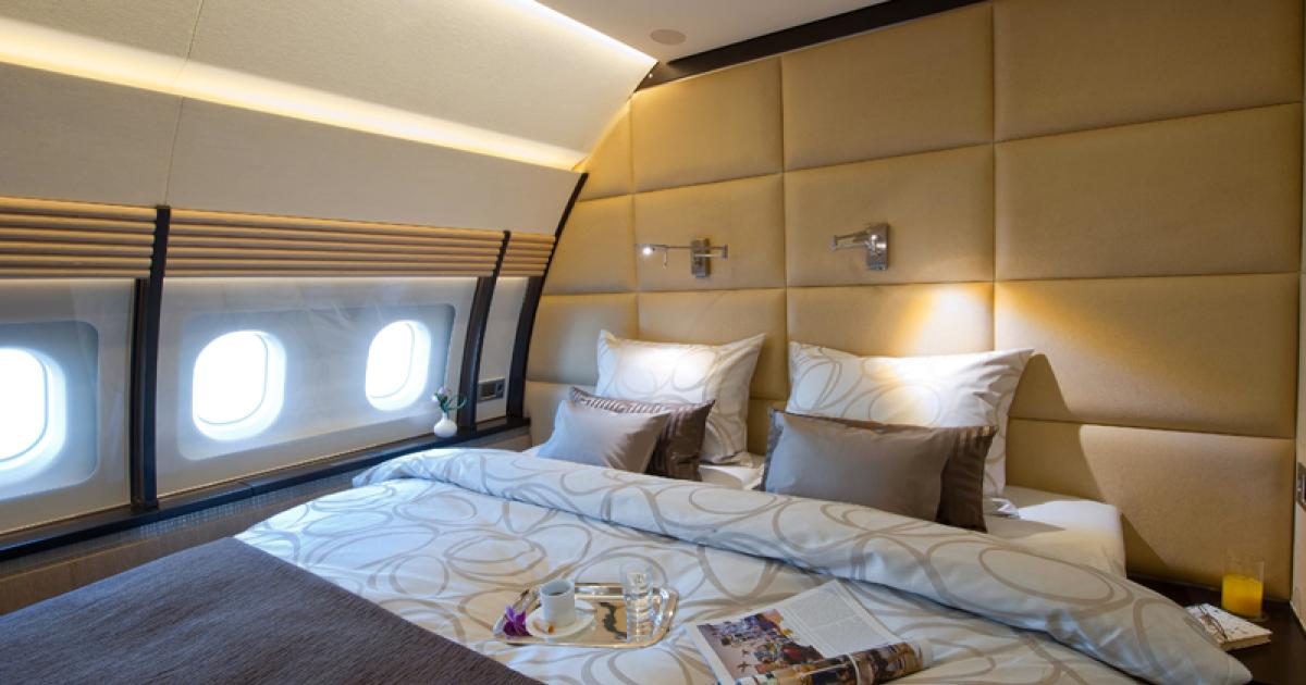 This Airbus ACJ319's master bedroom includes a queen-size bed with a divan and a large separate washroom with full-height oval shower.