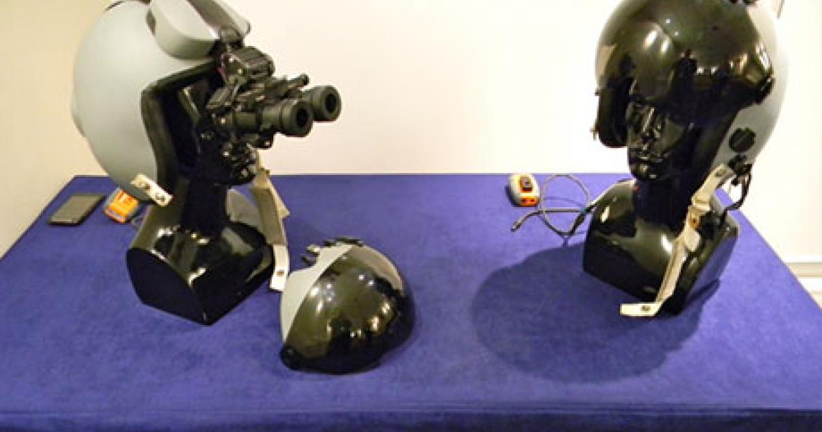 Elbit Systems of America exhibited its second-generation joint helmet-mounted cueing system (JHMCS) in night-vision and day configurations at the Paris Air Show. (Photo: Bill Carey)