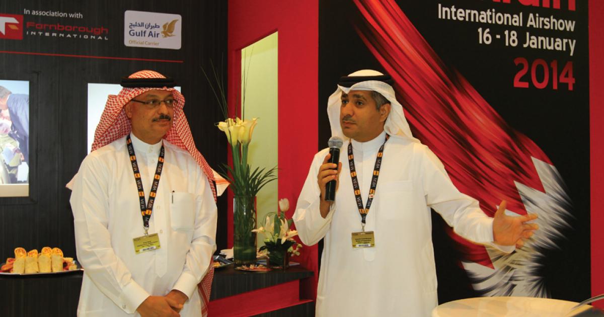Ahmed Nemal, Undersecretary for Aviation Services, and Kamal Bin Ahmed Mohamed, Minister of Transportation, Kingdom of Bahrain, discuss plans to expand the passenger terminal at the Bahrain International Airport.