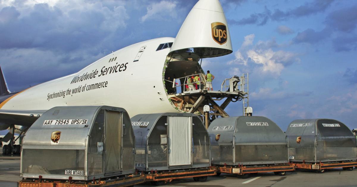 Workers load a UPS 747-400 freighter. The union representing UPS pilots is contesting the exclusion of cargo carriers from the FAA’s new pilot duty and rest requirements. The association representing cargo carriers has sided with the FAA. (Photo: UPS)
