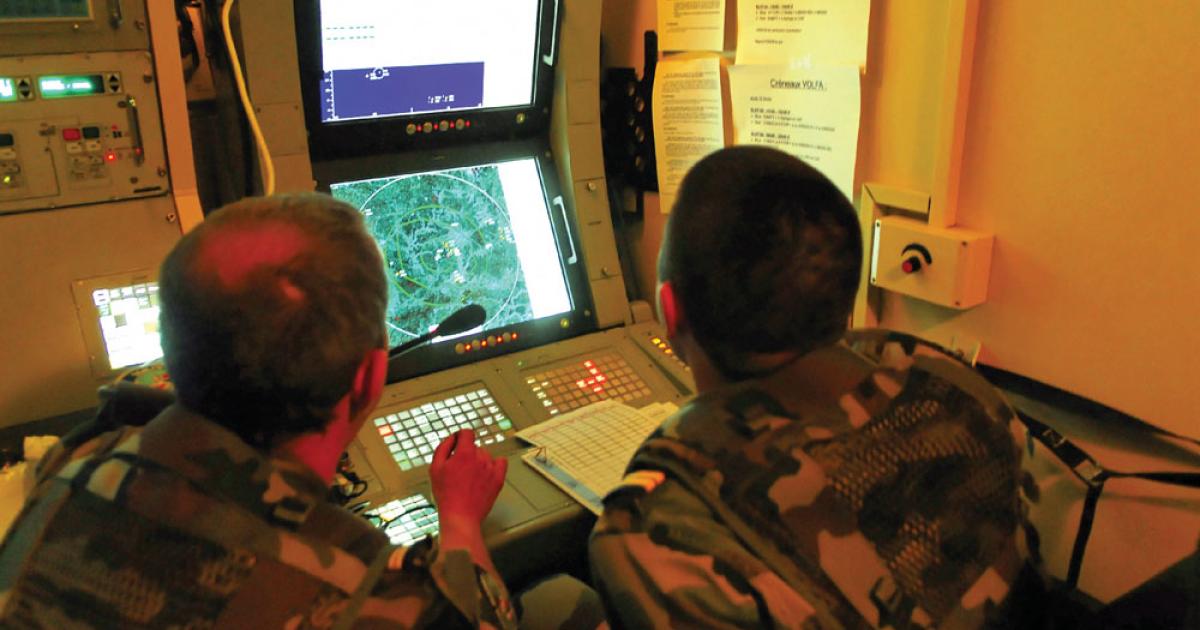 Soldiers monitor one of two consoles within the SAMP/T system radar van. 