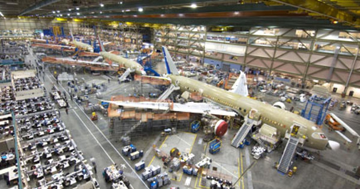The Boeing 787 Dreamliner assembly line remained busy even as the company halted delivery of certain fuselage components for the 23rd and 24th 787s until next month.
