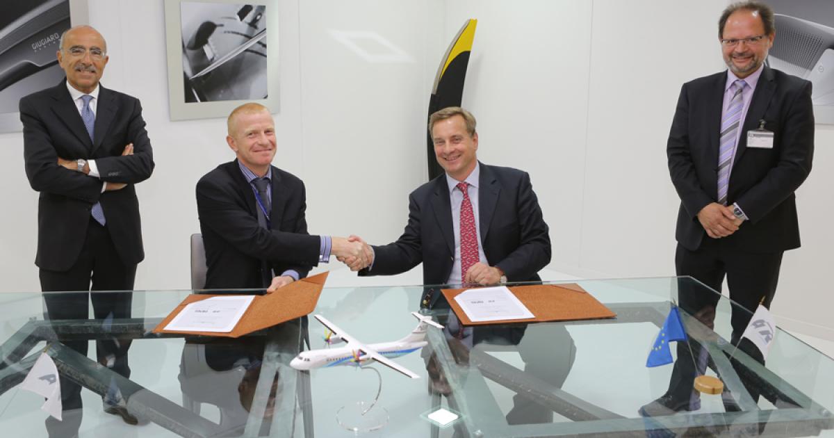 Lilian Brayle, ATR senior v-p of product support and services (seated left), and Johannes Graf von Schaesberg, Rheinland Air Service CEO (seated right), officially add RAS to ATR's European maintenance network, while Filippo Bagnato, ATR CEO (standing left), and Walter Lange, Rheinland Air Service COO, look on.