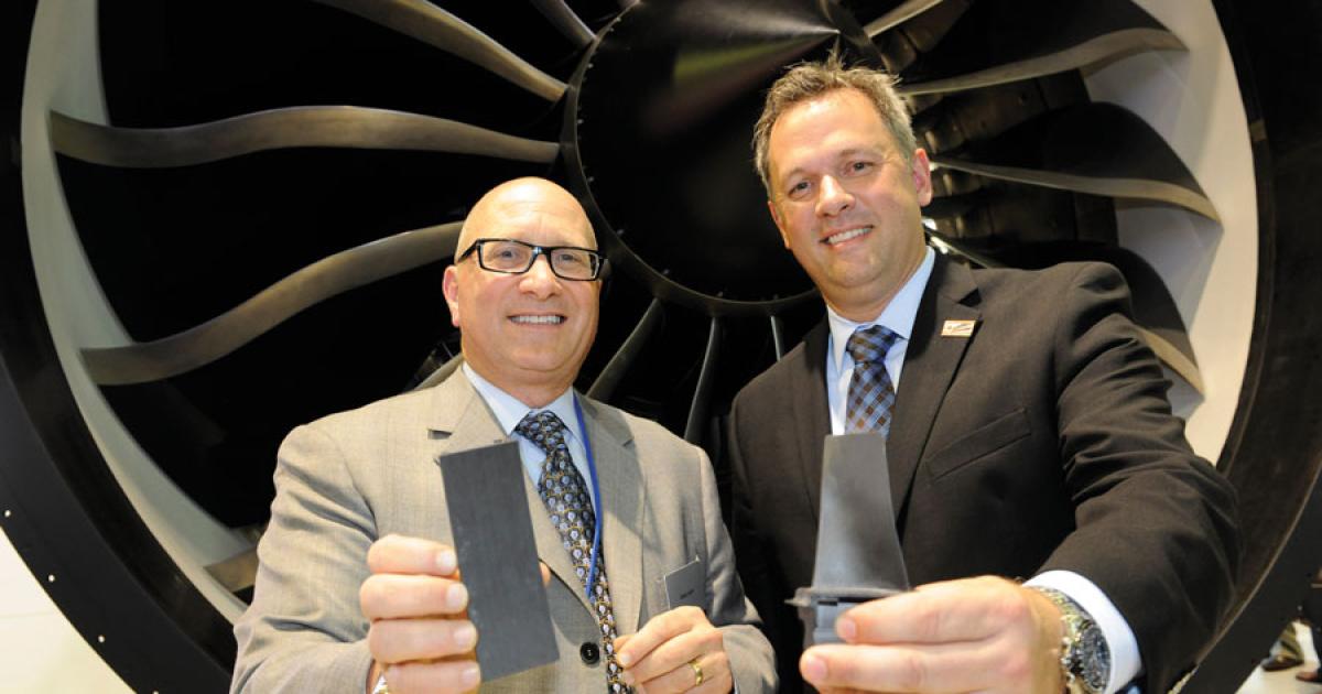 GE Aviation president and CEO David Joyce, left, announced that the engine maker will build a factory in North Carolina to produce ceramic matrix components. Dan Forest, N.C. lieutenant governor, shared the news.
