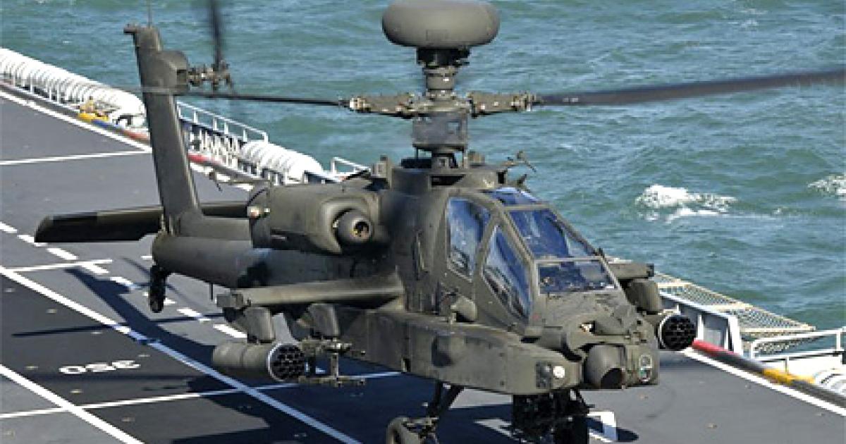 Attack helicopters, including this British AH-64D Apache, are launched from ships off the Libyan coast. (Photo: UK Crown)