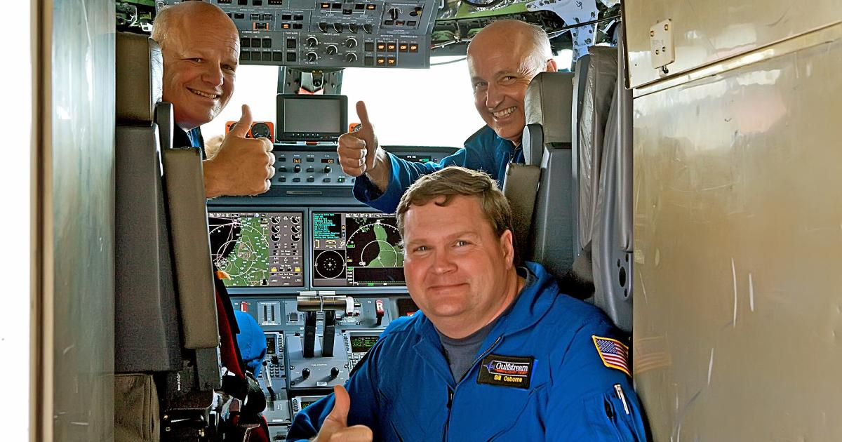 Members of the G650 flight-test crew celebrate achieving Mach 0.995. From left: Senior experimental test pilots Gary Freeman and Tom Horne and flight-test engineer Bill Osborne.