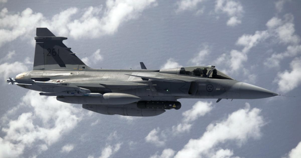 A Gripen refuels over the Mediterranean before heading to Libya. It carries a Litening targeting pod, the Saab SPK 39 reconnaissance pod and Iris-T missiles.