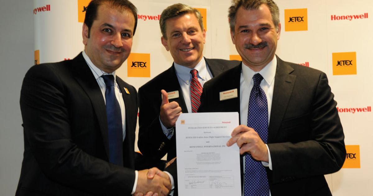 Jetex president and CEO Adel Mardini, left, signed this joint venture  agreement with Honeywell’s Rob Wilson, center, and Carl Esposito. (Photo: Mark Wagner)