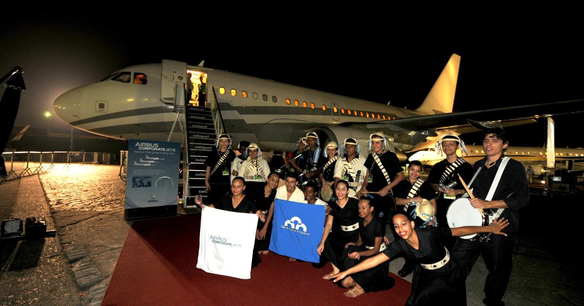 The ACJ318 from charter operator Globaljet on display at LABACE 2012 is celebrated by the Batucada children's band. (Photo: Airbus)
