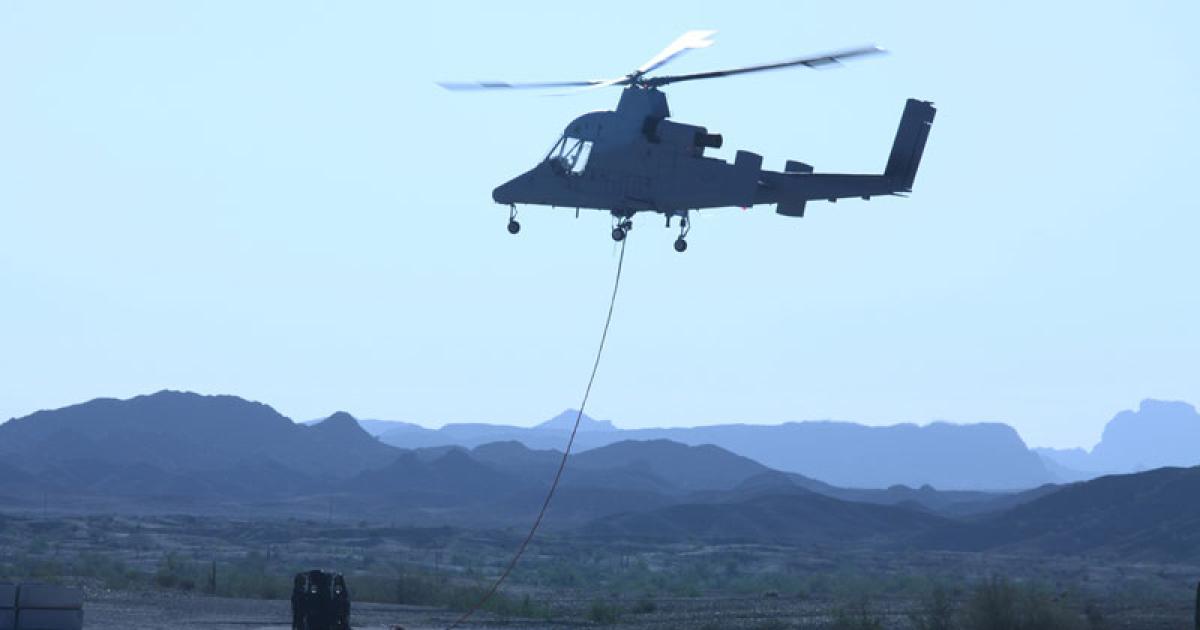 The unmanned K-Max helicopter prepares to lift a load during a recent evaluation, which resulted in a go-ahead for deployment to Afghanistan. (Photo: Lockheed Martin)