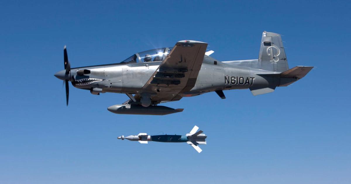 Hawker Beechcraft AT-6 launches weapon during U.S. Air National Guard operational assessment. (Photo: Hawker Beechcraft)