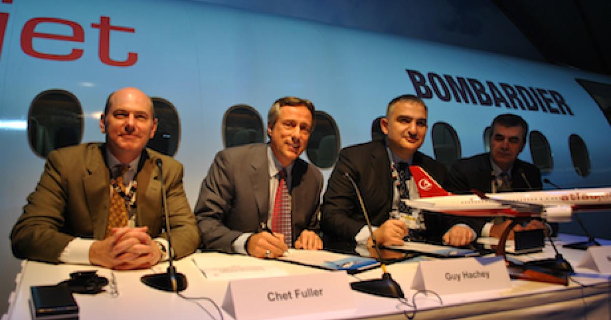 Turkish low-fare carrier Atlasjet signed for 15 C Series CS300 narrowbodies at Dubai 2011. At the November 15 signing were (L-R): Bombardier Aerospace vp of sales Chet Fuller, president and COO Guy Hachey, Atlasjet chairman Murat Ersoy and Orhan Coskun from Atlasjet.