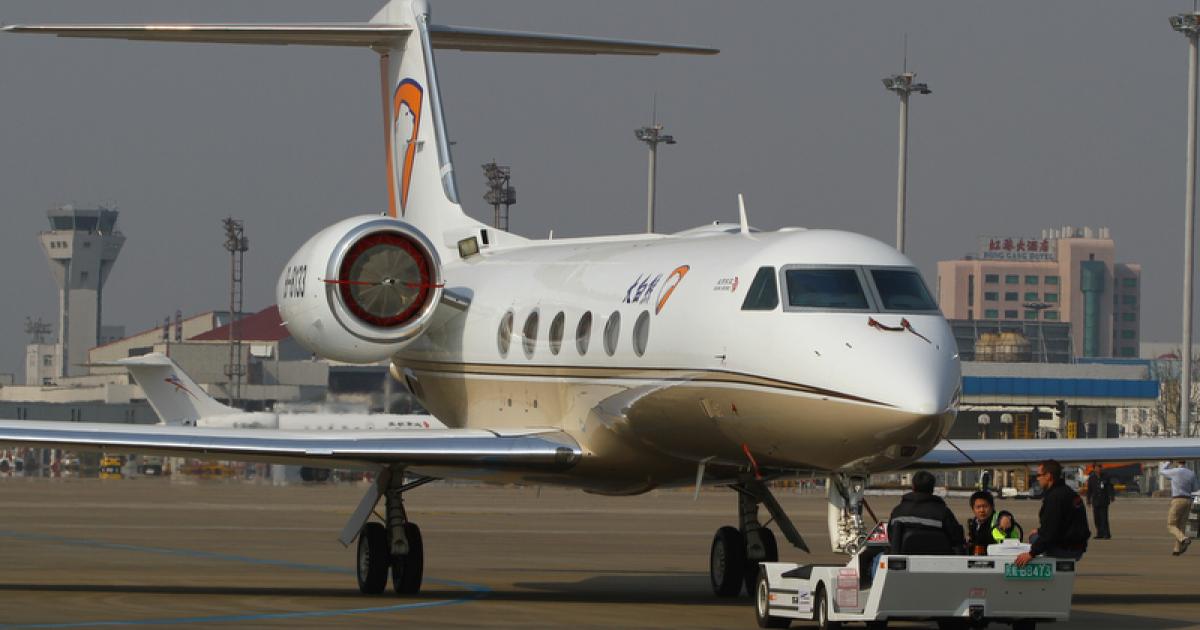 A Gulfstream G450 is towed to the ABACE static display on Shanghai's Hongqiao Airport.