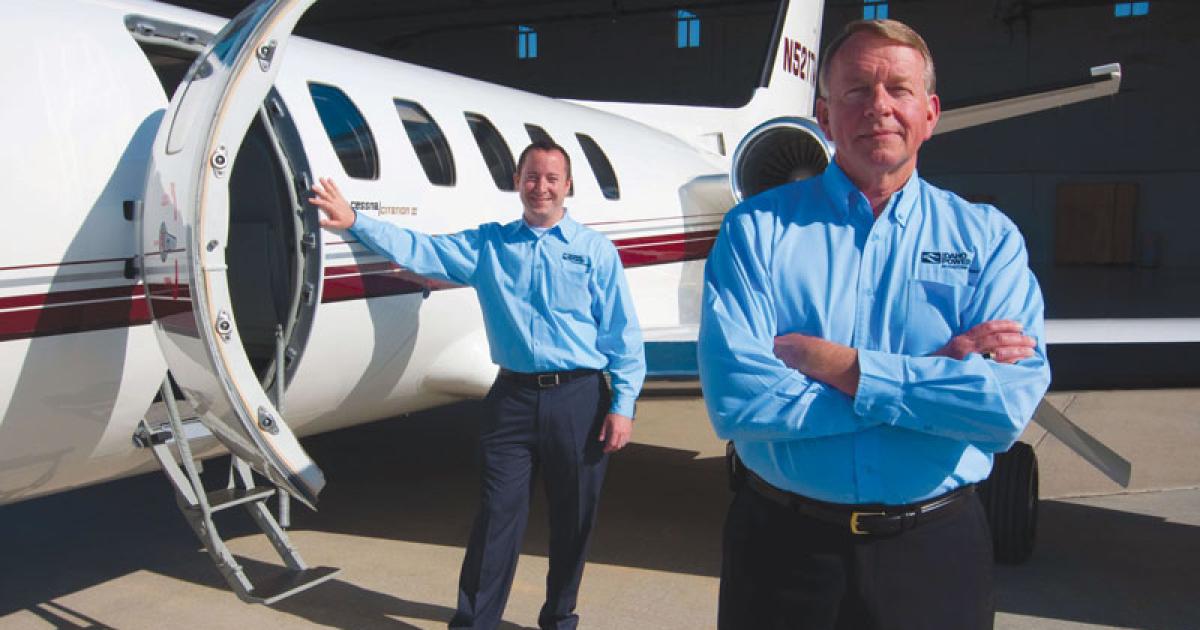 Rick Johnson, foreground, Idaho Power’s chief pilot in front of the company’s Cessna Citation II.