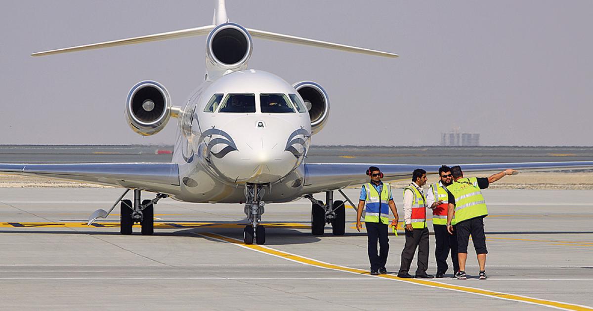 The owner of this Falcon 7X, shown here on the ramp of Al Maktoum International Airport soon after its arrival for display at MEBA, will be able to simply turn on his cellphone and start using it while in flight, if he opts to buy OnAir’s mobile equipment when available in 2014.
