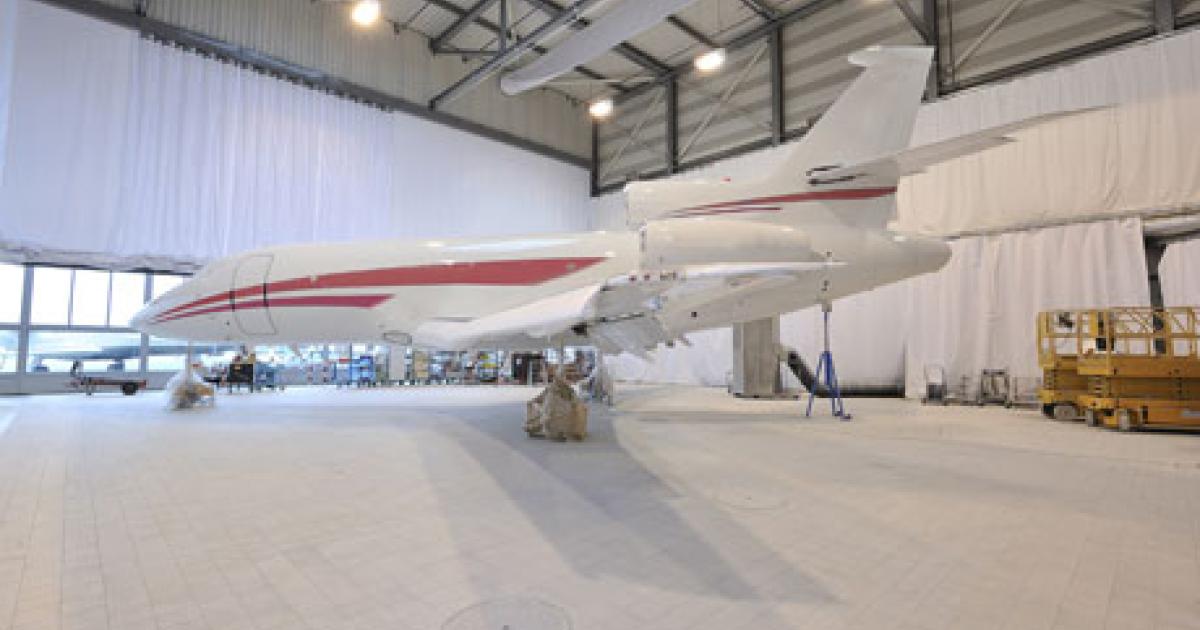Repainting the aircraft is part of TAG’s installation of Aviation Partners’ high-Mach blended winglets on the Falcon 2000/2000EX and 900.