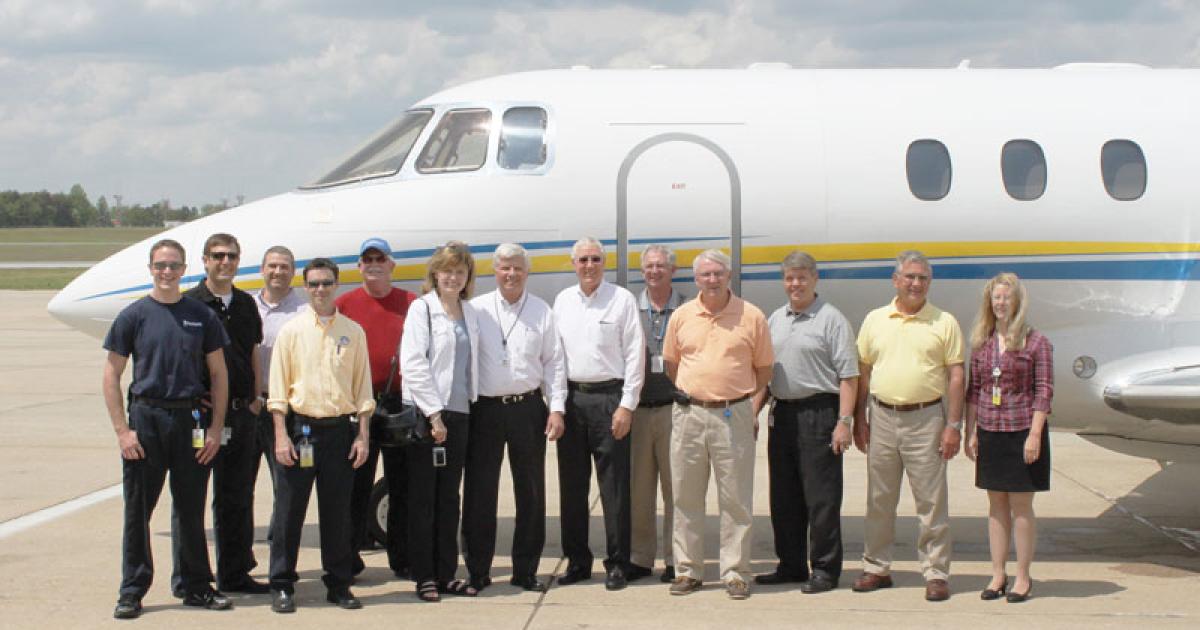 Retired pilot Stuart Swanson, seventh from left, with the Michelin North America team.