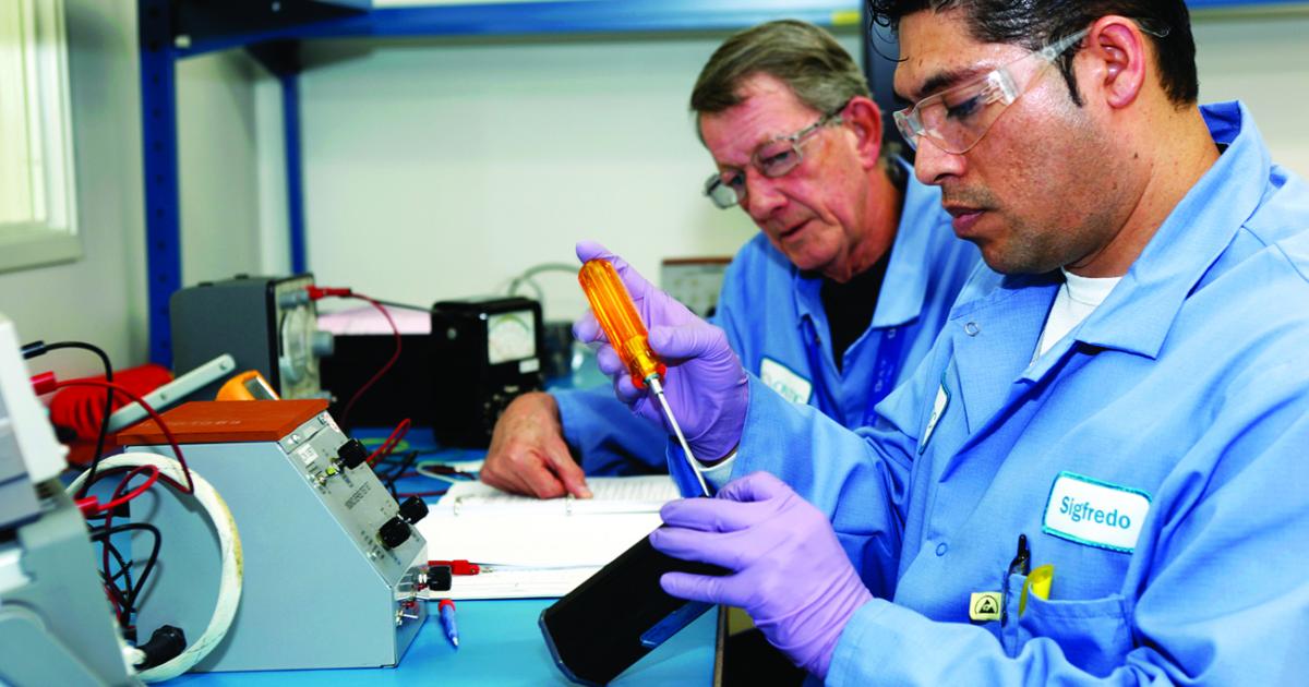Working on capacitance probes on the fuel quantity indicating system for the Airbus A320 are Ontic's electronics lead Pedro Paiva and electronic technician Sigfredo Mendoza.