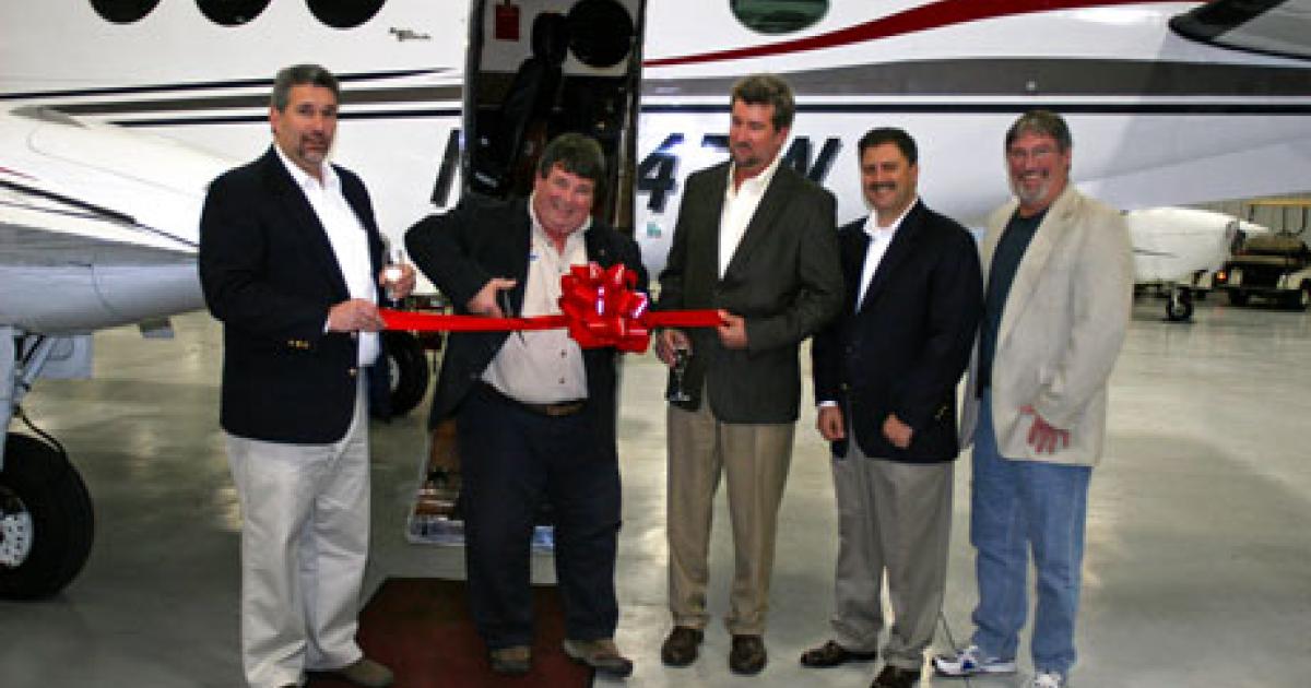 (l to r) Neal Ropp, director of maintenance at Smyrna Air Center; Greg Ryan, sales director for GE Aviation; Bob Fields, CEO of Smyrna Air Center; Curt Drumm, owner of Lakeshore Aviation; Brenda Fields, COO of Smyrna Air Center; and Dan Sigl, director of Power90 business development, at the delivery of the first King Air C90 powered by the GE H80.