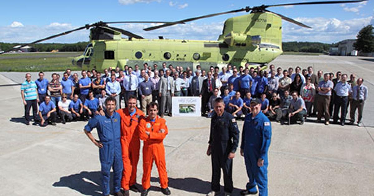 AgustaWestland employees commemorate the first flight of an ICH-47F Chinook at Vergiate, northern Italy, on June 24. (Photo: AgustaWestland)