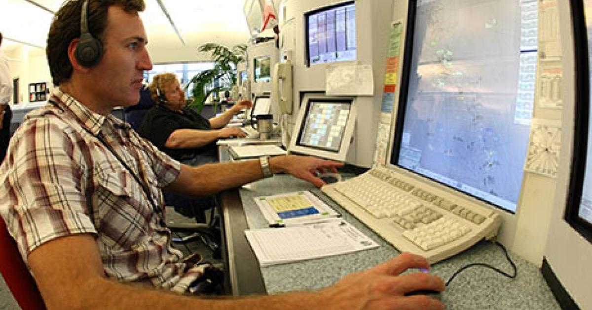 An en route controller monitors air traffic at the Airservices Australia Melbourne Center. (Photo: Airservices Australia)
