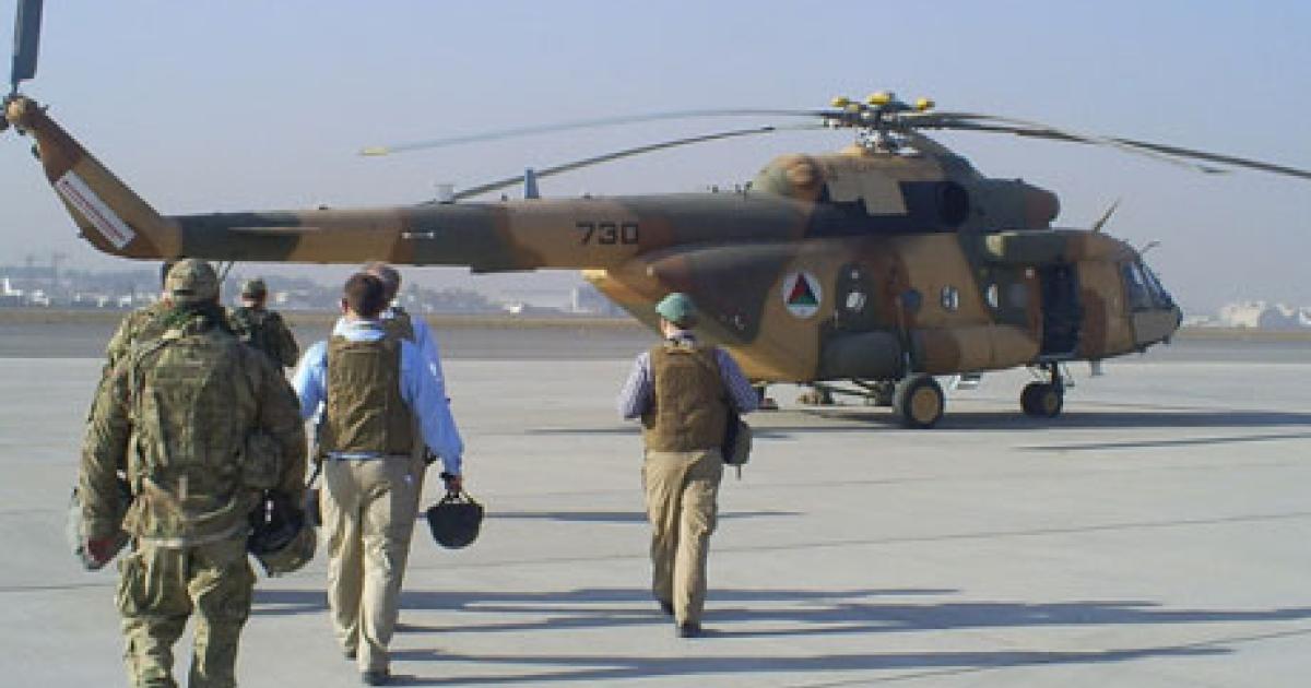 An Afghan Special Mission Wing flight crew prepares for a training mission aboard a Mil Mi-17 in Kabul last October. (Photo: SIGAR)
