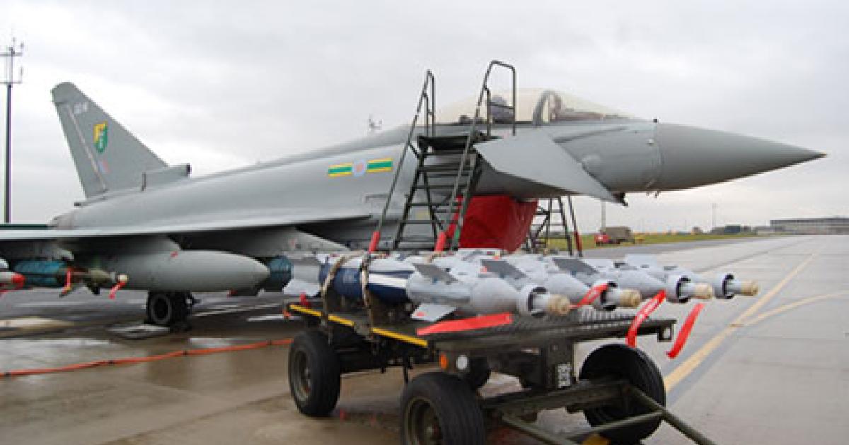 Raytheon Paveway IV weapons on their transporter, next to a Royal Air Force Eurofighter Typhoon. (Photo: Chris Pocock)