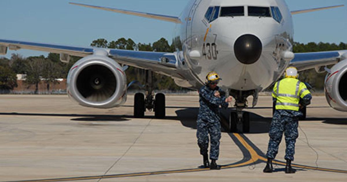 Airmen assigned to Patrol Squadron 16 direct a P-8A Poseidon on the flight line at Naval Air Station Jacksonville, Fla. (Photo: U.S. Navy)