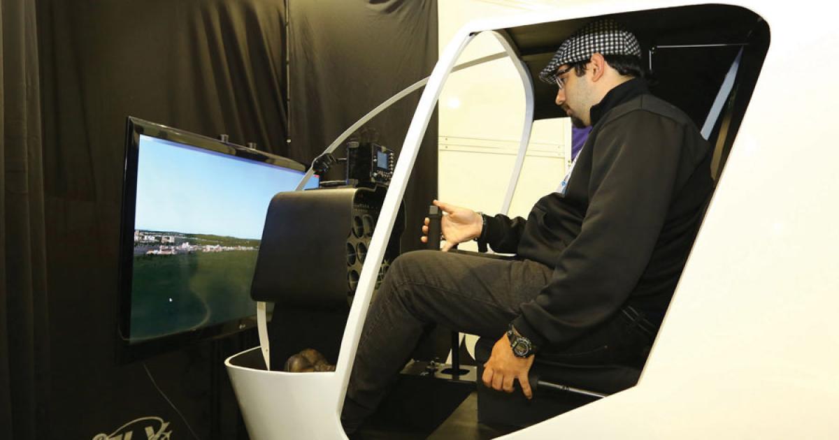 Brazilian flight training provider Efly demonstrates a locally built Marcnamara simulator at its stand. The manufacturer recently received ANAC approval for its King Air training device. (Photo: David McIntosh)