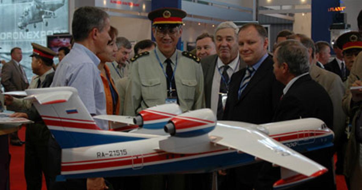 A model of the Beriev Be-200c3 amphibian attracts attention at the Moscow Air Show last week. (Photo: Vladimir Karnozov)