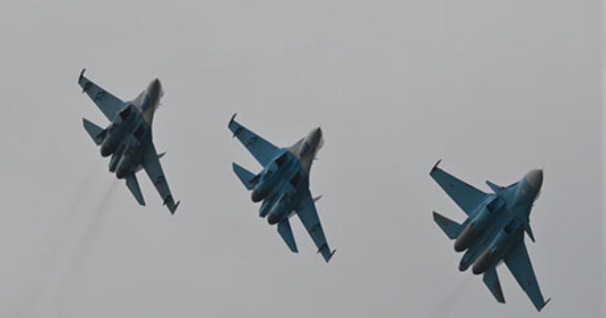 Instructor pilots from the Russian air force Center for Type Conversion and Re-Training Center at Lipetsk airbase flew this formation of two Su-27s and one Su-34 at the Moscow Air Show. (Photo: Vladimir Karnozov)