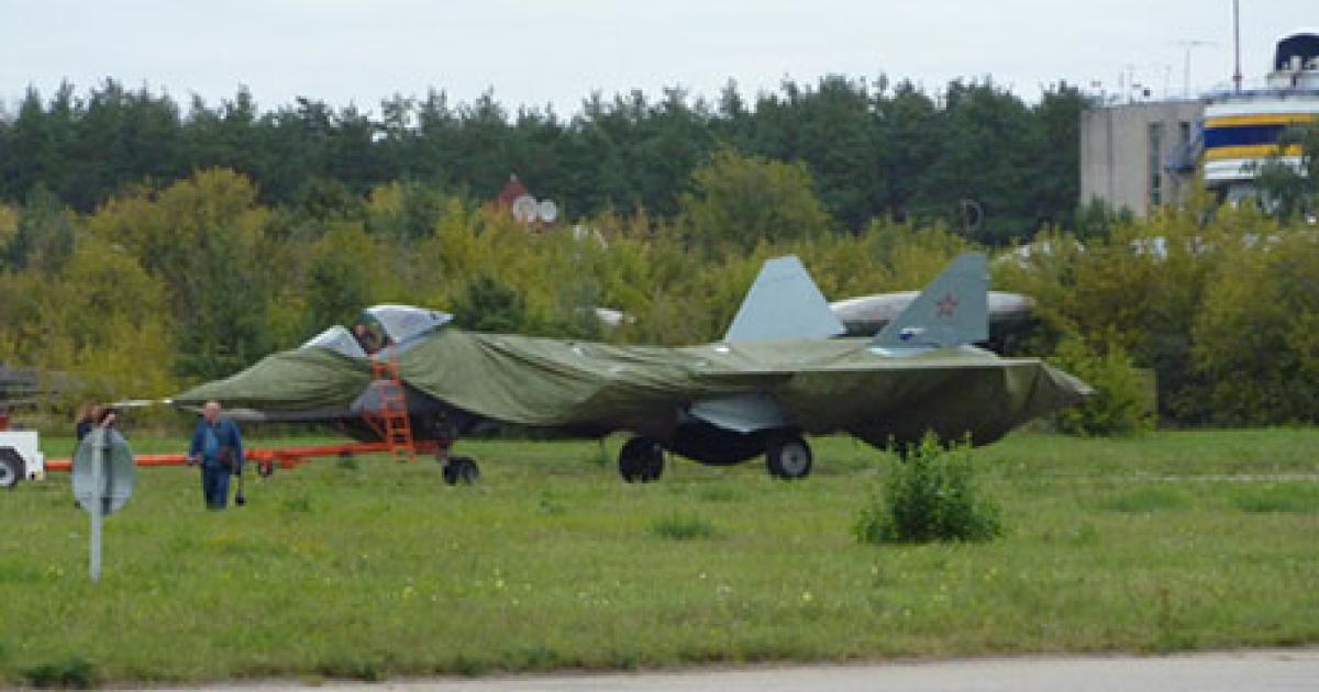 A Sukhoi T-50 prototype is towed under wraps at the recent Moscow Air Show. (Photo: Reuben F. Johnson)