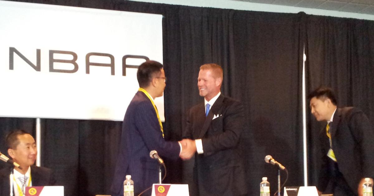 Xie Xin, chairman, Deer Jet and Randall Reed, CEO Starbase, signed a strategic alliance for air charter at NBAA 2013.