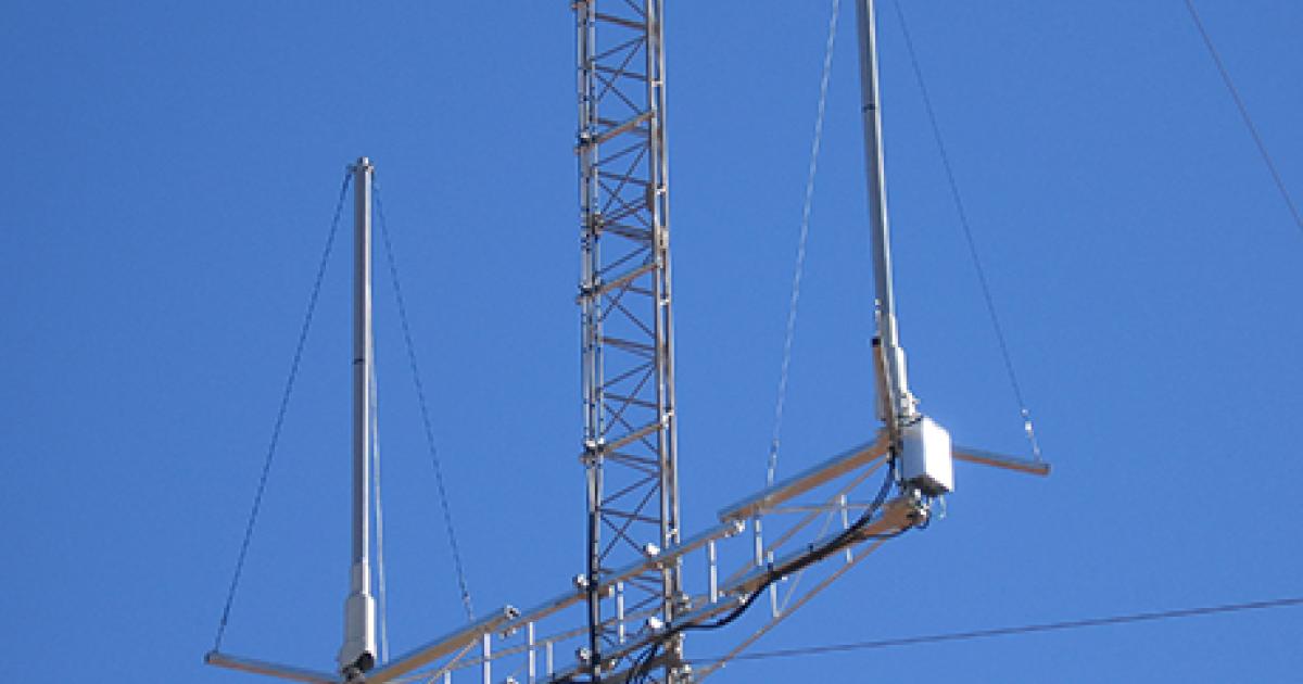 Two ADS-B antennas are shown atop a communications tower at Warburton, Australia. (Photo: Airservices Australia)