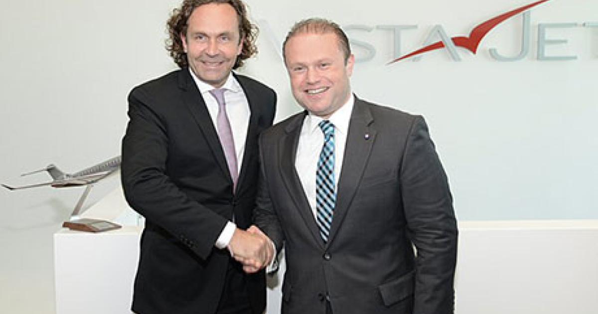 VistaJet founder and chairman Thomas Flohr and Malta Prime Minister Joseph Muscat celebrate the opening of VistaJet's new European operations center in Malta.
