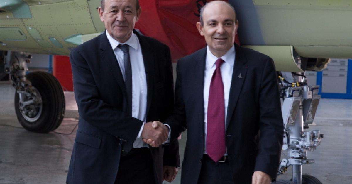 French defense minister Jean-Yves le Drian (left) visited the Rafale final assembly line in Bordeaux to seal the latest upgrade contract with Dassault chairman and CEO Eric Trappier. (Photo: Dassault Aviation)