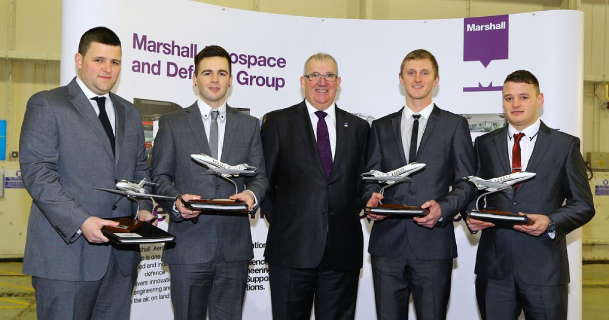 Marshall Aerospace and Defence Group CEO Steve Fitz-Gerald (center) honors apprentices (l to r) Ben Worrall, Rhys Edwards, Tom Griffith and Andy Thomas.