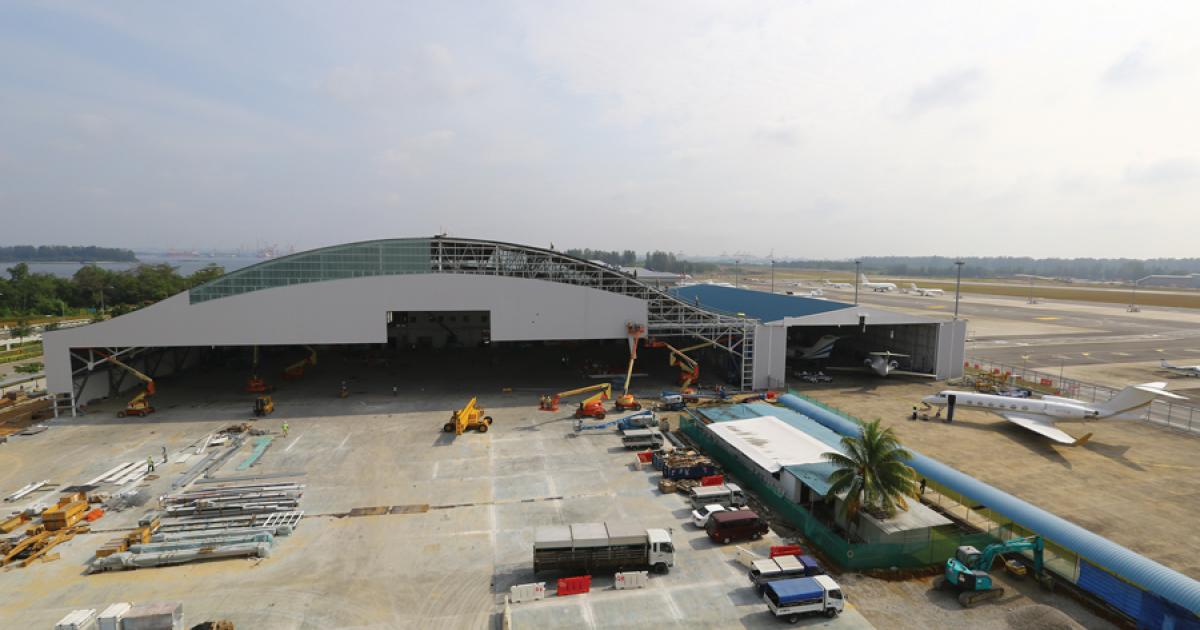 Jet Aviation’s expanded Seletar hangar triples the size of the original structure at right. 