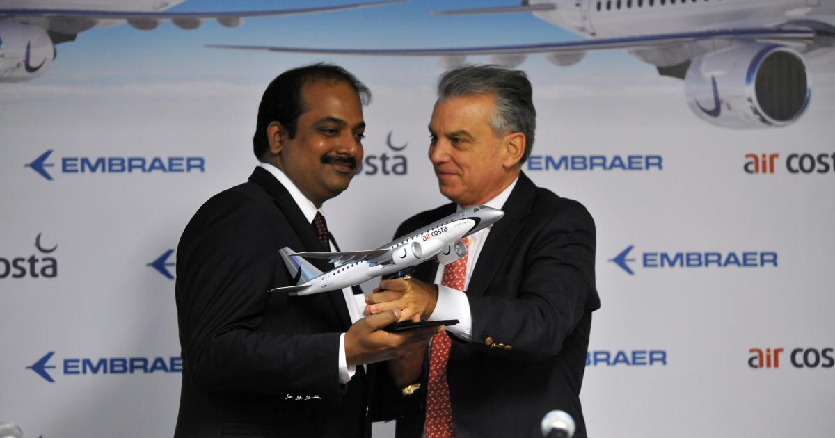 Air Costa chairman Ramesh Lingamaneni (left) seals a deal for Embraer E-Jet E2 aircraft with Embraer president and CEO Paulo Cesar Silva.