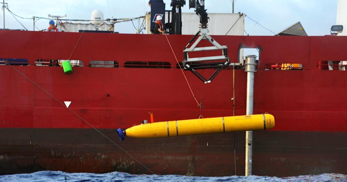 U.S. Navy contractors lower the Bluefin-21 autonomous underwater vehicle into the Indian Ocean from the deck of the Australian vessel Ocean Shield during the search for MH370. (Photo: U.S. Department of Defense)