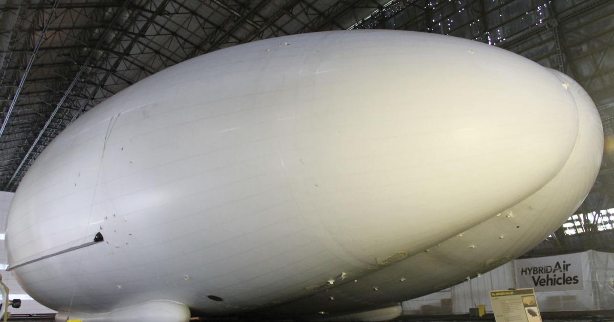 After being packed and shipped to the UK, the Airlander 10, formerly known as the LEMV was air-inflated at Cardington in February of this year. One of the engine ducts can just been seen at left. The engines and tailfins were not yet attached.