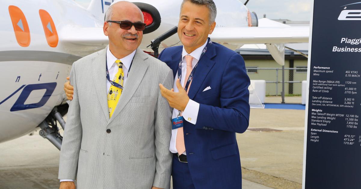 Bravia Capital CEO Bharat Bhisé, left, has placed an order for 10 Piaggio Aero Avanti EVOs with options for another 40. Congratulating his customer is Piaggio Aero CEO Carlo Logli. 