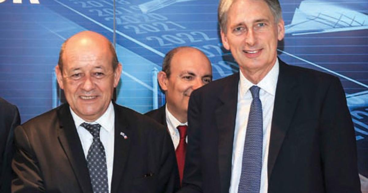British Secretary of Defence Philip Hammond (right) and his French counterpart Jean-Yves le Drian signed an agreement to launch a two-year study on unmanned combat aircraft.