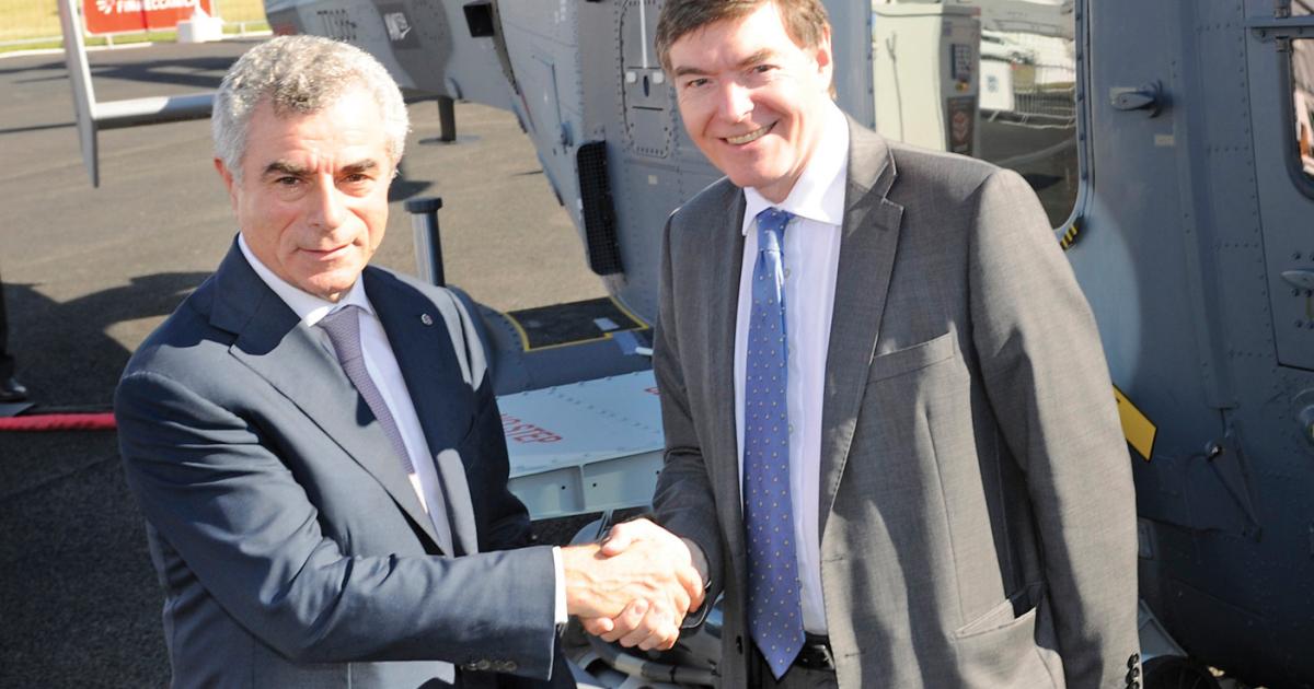 British defense procurement minister Philip Dunne (pictured right) signed the deal with Finmeccanica CEO Mauro Moretti