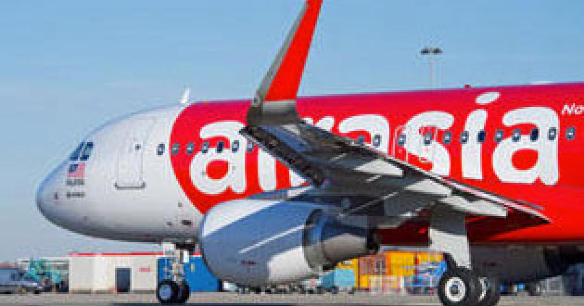 An Air Asia Airbus A320 almost collided with another aircraft at an Indonesian airport after a mix-up between pilots and controllers.
