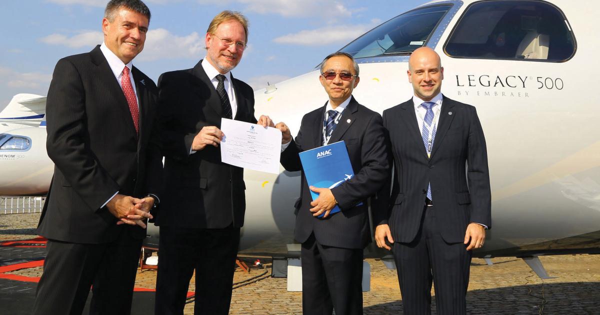 Celebrating ANAC certification of the Legacy 500 are (left to right) Embraer CEO Marco Túlio Pellegrini; Mauro Kern, Embraer executive v-p of technology and engineering; and ANAC officials Dino Ishikura and Marcelo Pacheco dos Guaranys. (Photo: David McIntosh)