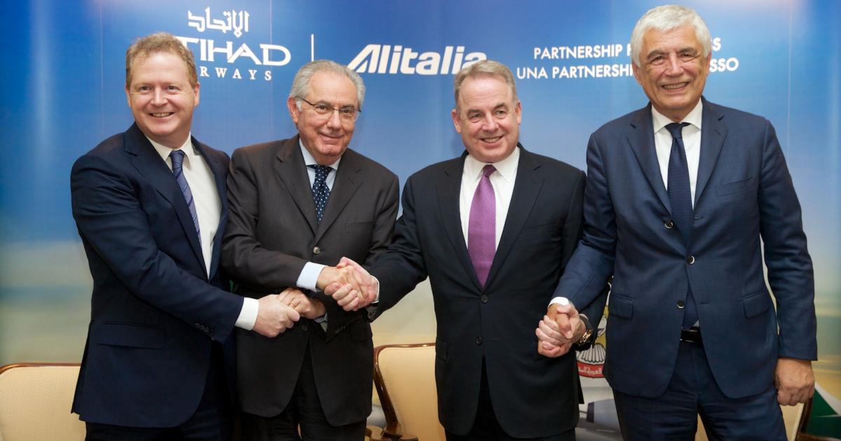 From left to right, Etihad CFO James Rigney, Alitalia chairman Roberto Colaninno, Etihad CEO James Hogan and Alitalia CEO Gabriele Del Torchio celebrate agreement. (Photo: Etihad Airways) 