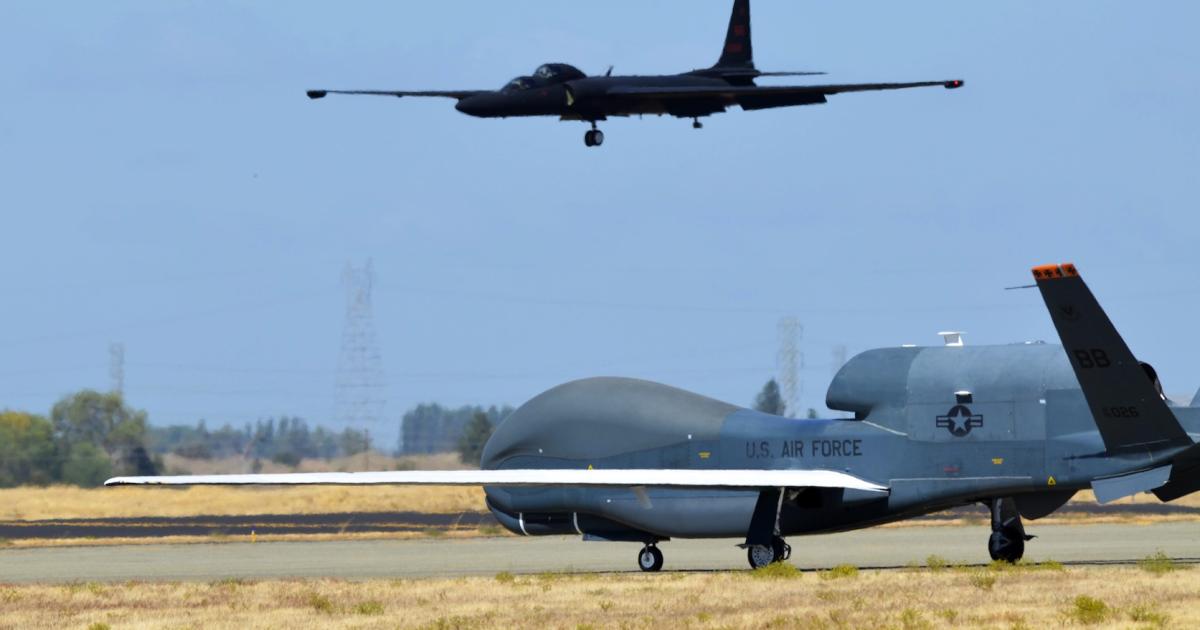 An RQ-4 Global Hawk taxis on the flight line at Beale Air Force Base, Calif., as a U-2 prepares to land. (Photo: U.S. Air Force)